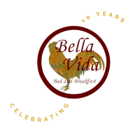 BellaVida Bed and Breakfast Celebrating 10 Years Circular BellaVida logo with a rooster in the center. To the outside are the words: celebrating 10 years.