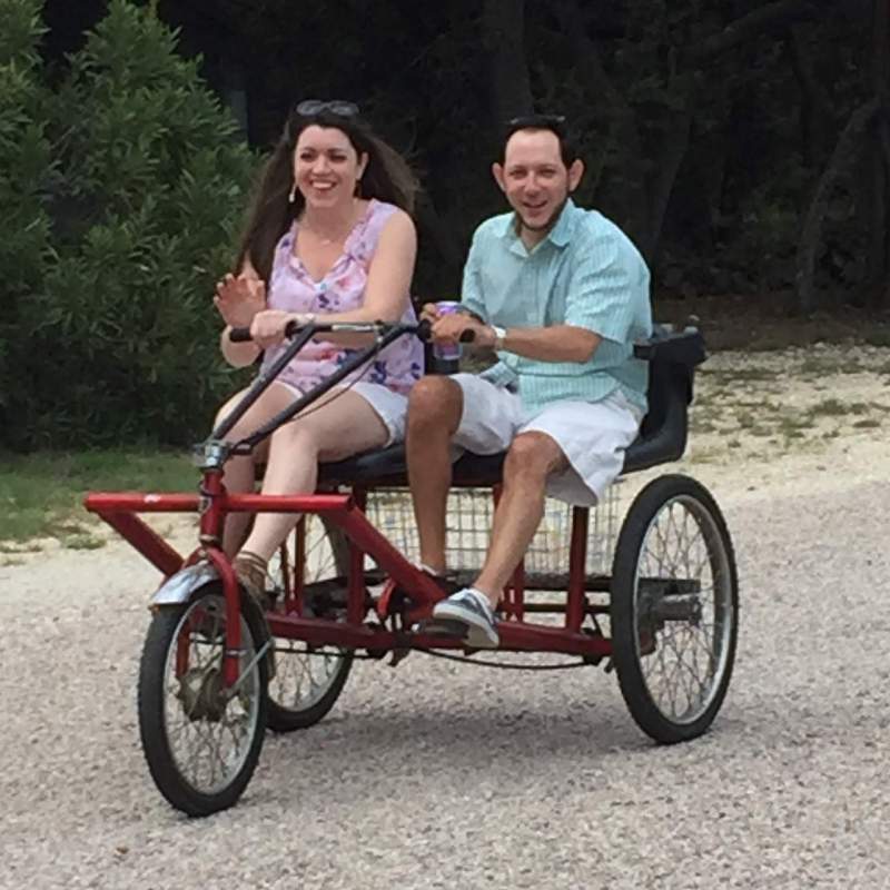 Bike for two riders Bicycling on the property on a trike built for two.