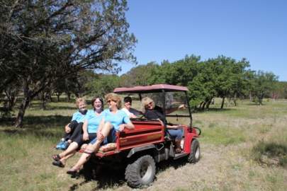 Girlfriends ride an ATV at BellaVida Bed and Breakfast.