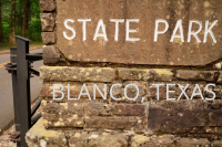 Blanco State Park's official sign.