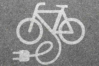 Grey background with white symbol for electric bicycle.