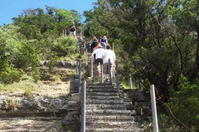 Group of people climbing the steps up Old Baldy.