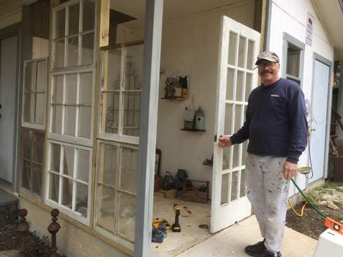 Vintage windows and door repurposed for a potting shed.