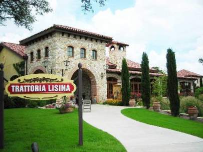 Well landscaped restaurant with Italian architecture.