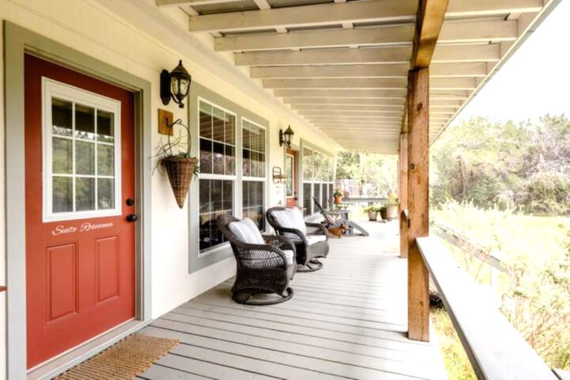 Suite Roseanna private entrance and porch with two swivel rockers for enjoying the Texas Hill Country view.